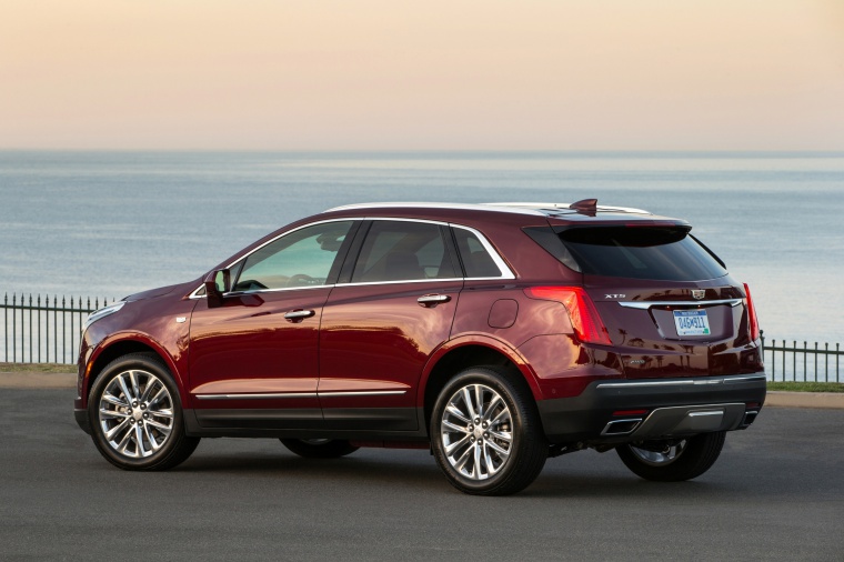 2019 Cadillac XT5 AWD in Red from a rear left three-quarter view